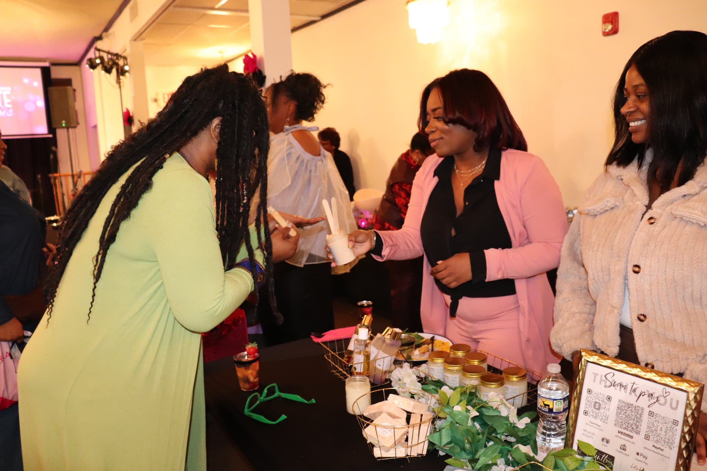 Vendor conversation during the A Date With Sis marketplace