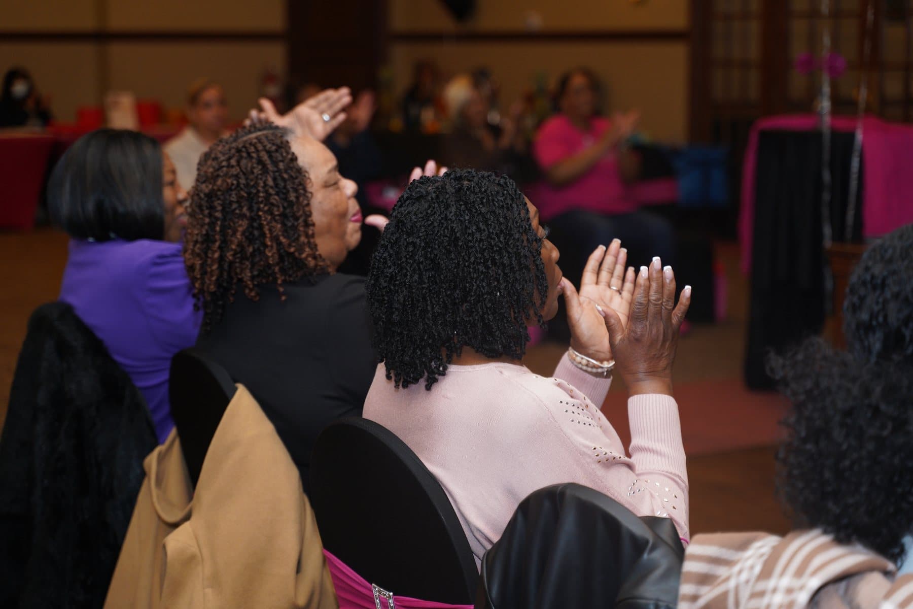 Women responding during the event program