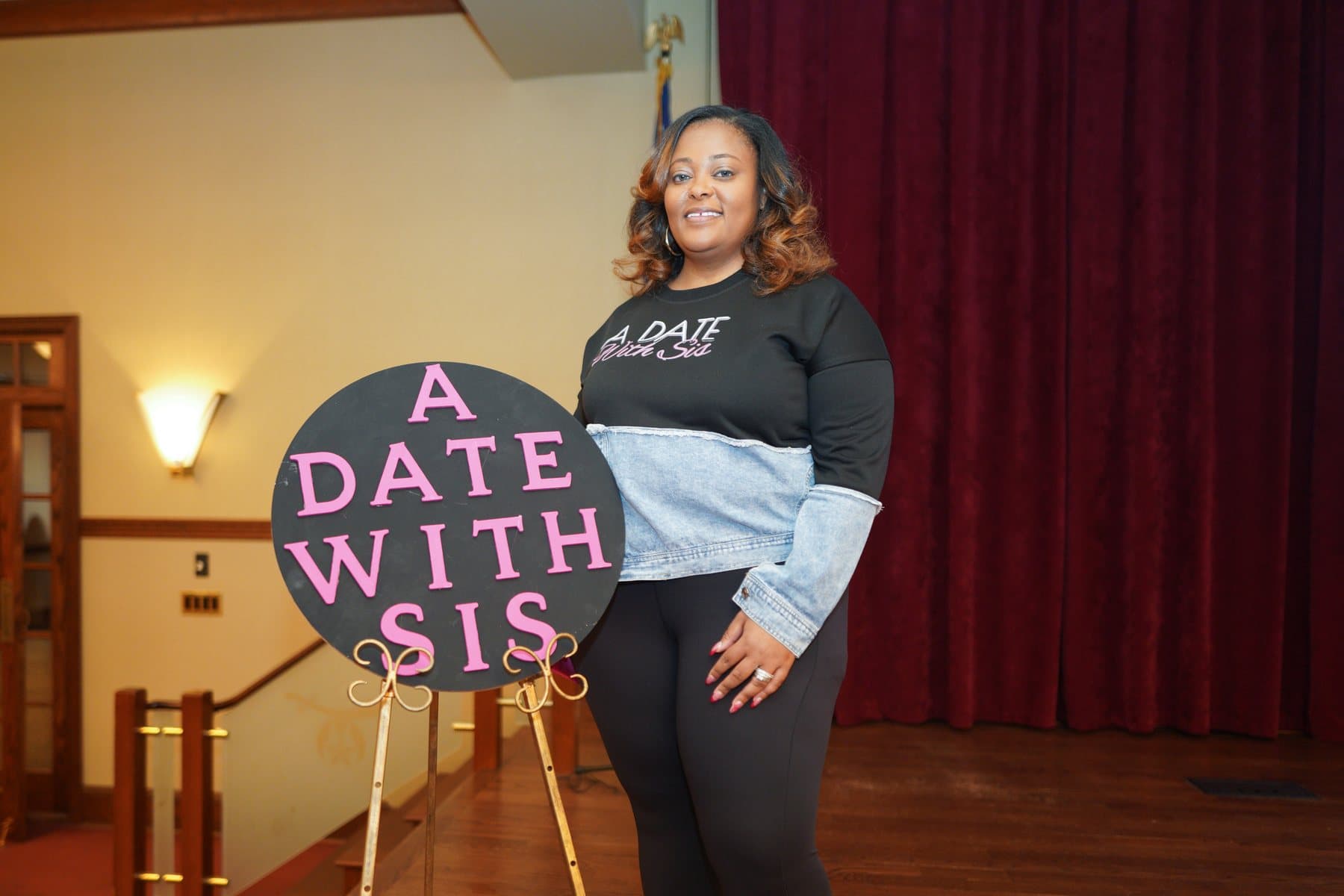 A Date With Sis branded sign