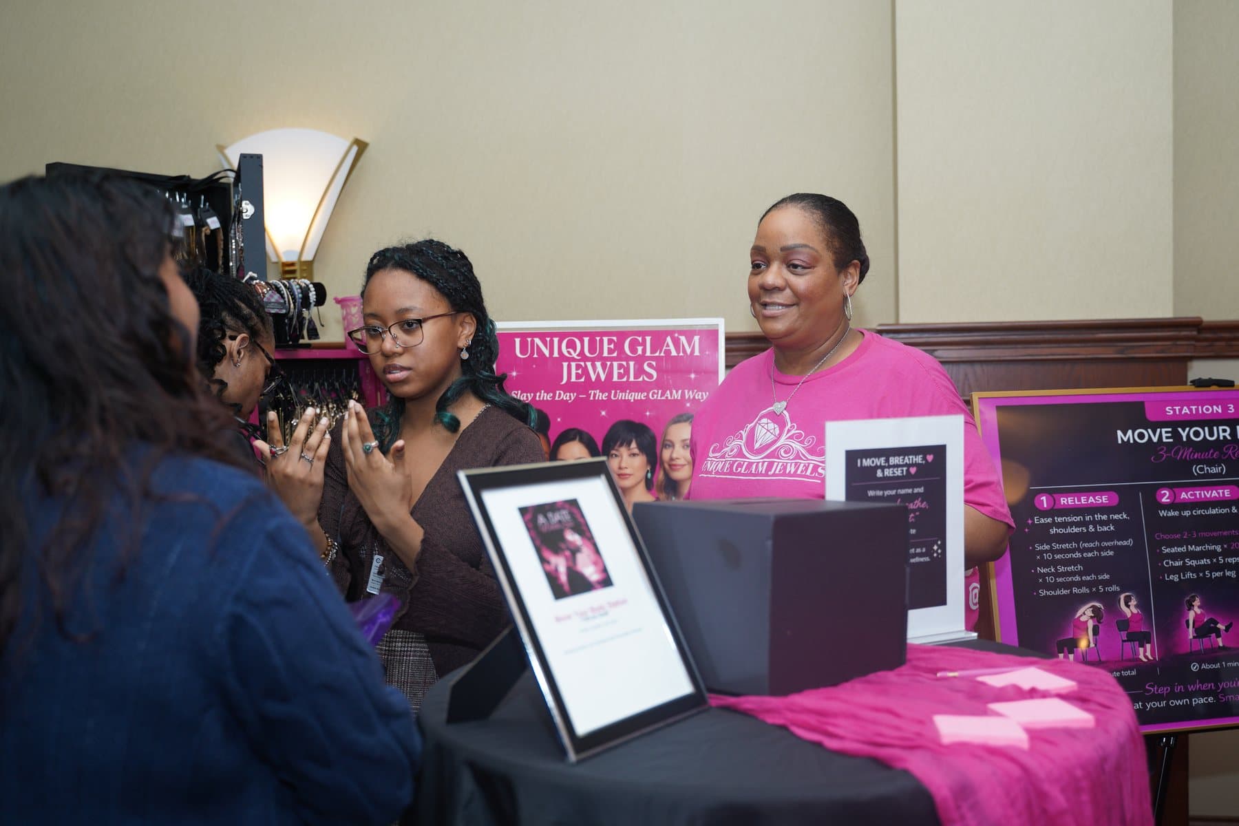 Vendor speaking with guests at A Date With Sis
